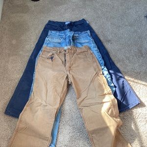 Bundle of three Fr rated pants. Tan and blue pants are in good condition.